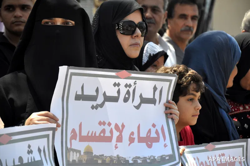 Palestinian women gather for a demonstration calling for the end of the political division between the Gaza Strip Hamas-led leadership and the Palestinian Authority Fatah-led in the West Bank city of Ramallah, on Aug. 20...