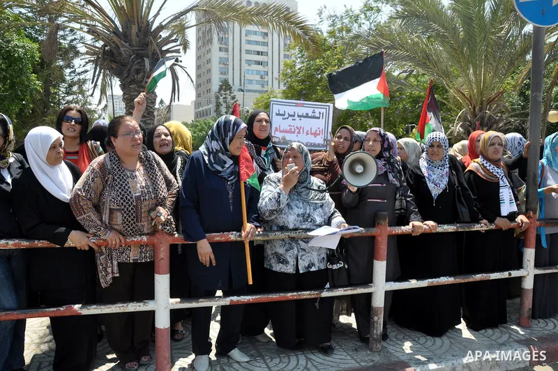 Palestinian women gather for a demonstration calling for the end of the political division between the Gaza Strip Hamas-led leadership and the Palestinian Authority Fatah-led in the West Bank city of Ramallah, on Aug. 20...
