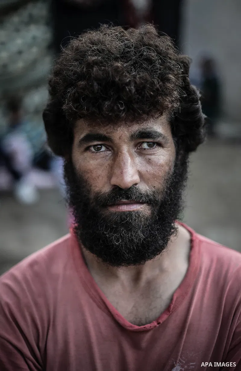 A picture taken on July 31, 2013 a Palestinian poor man posing for a photograph at his home in Jabalia refugee camp northern Gaza Strip. Photo by Mahmoud Hamda