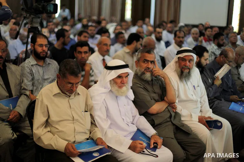 Palestinians attend the opening of the national program for the performance indicators for charity associations and community organizations, in Gaza city, on Aug. 21, 2013. Photo by Ashraf Amra