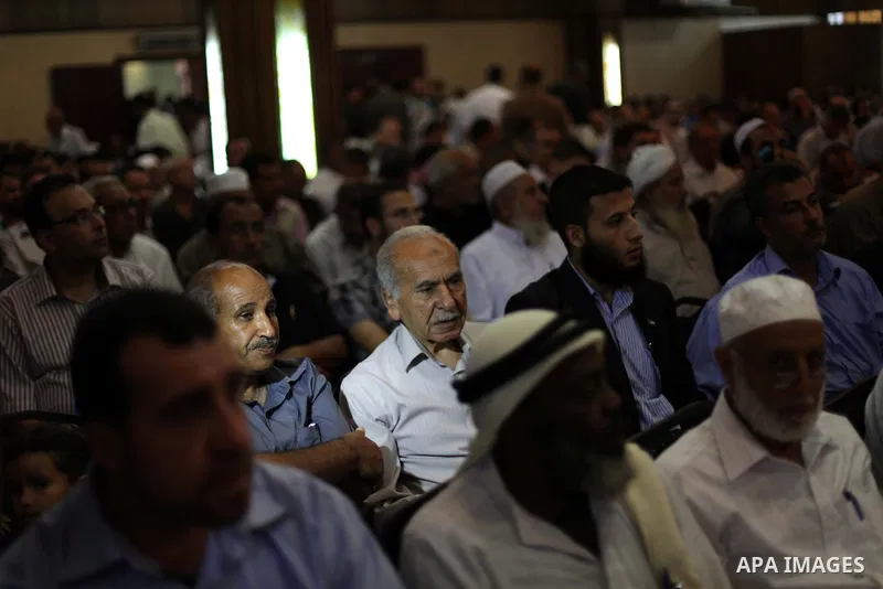 Palestinians attend the opening of the national program for the performance indicators for charity associations and community organizations, in Gaza city, on Aug. 21, 2013. Photo by Ashraf Amra