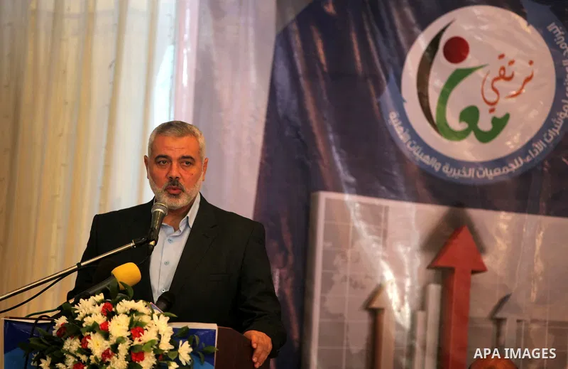 Palestinian Prime Minister in the Gaza Strip, Ismail Haniya, speaks during the opening of the national program for the performance indicators for charity associations and community organizations, in Gaza city, on Aug. 21...