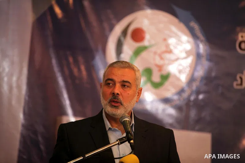 Palestinian Prime Minister in the Gaza Strip, Ismail Haniya, speaks during the opening of the national program for the performance indicators for charity associations and community organizations, in Gaza city, on Aug. 21...