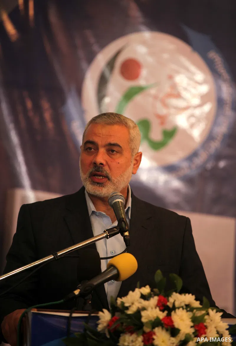 Palestinian Prime Minister in the Gaza Strip, Ismail Haniya, speaks during the opening of the national program for the performance indicators for charity associations and community organizations, in Gaza city, on Aug. 21...