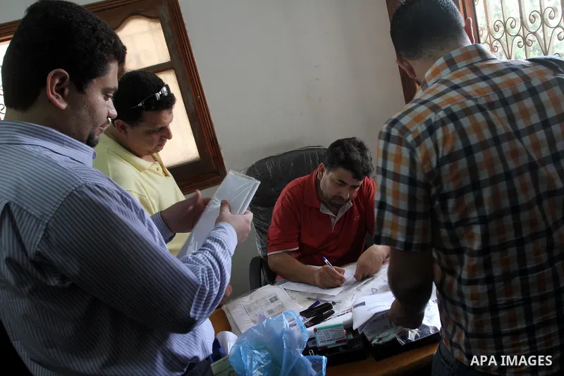 Palestinians wait to register for travel throw the Beit Hanoun crossing (Erez) at the Ministry of Civil affairs' office, in Gaza City Aug 21, 2013. Israel and the Palestinians have has agreed on temporarily opening the B...
