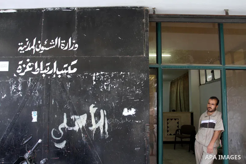 A Palestinian man waits to register for travel throw the Beit Hanoun crossing (Erez) at the Ministry of Civil affairs' office, in Gaza City Aug 21, 2013. Israel and the Palestinians have has agreed on temporarily opening...