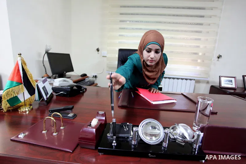 The youngest Palestinian minister in the world, Bashaer Osman receive work as minister for local government in the West Bank city of Ramallah on Aug. 22, 2013. Photo by Issam Rimawi