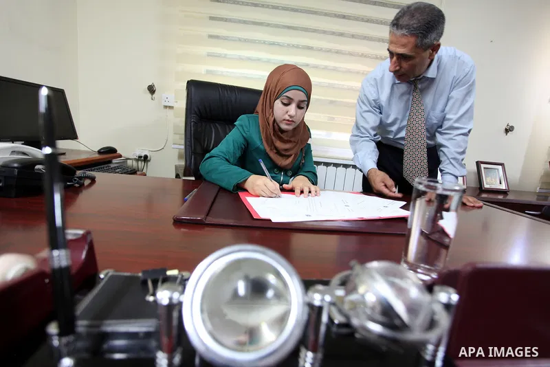 The youngest Palestinian minister in the world, Bashaer Osman receive work as minister for local government in the West Bank city of Ramallah on Aug. 22, 2013. Photo by Issam Rimawi