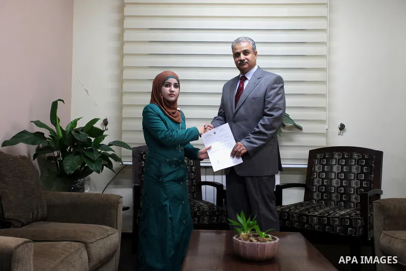 The youngest Palestinian minister in the world, Bashaer Osman receive work as minister for local government in the West Bank city of Ramallah on Aug. 22, 2013. Photo by Issam Rimawi