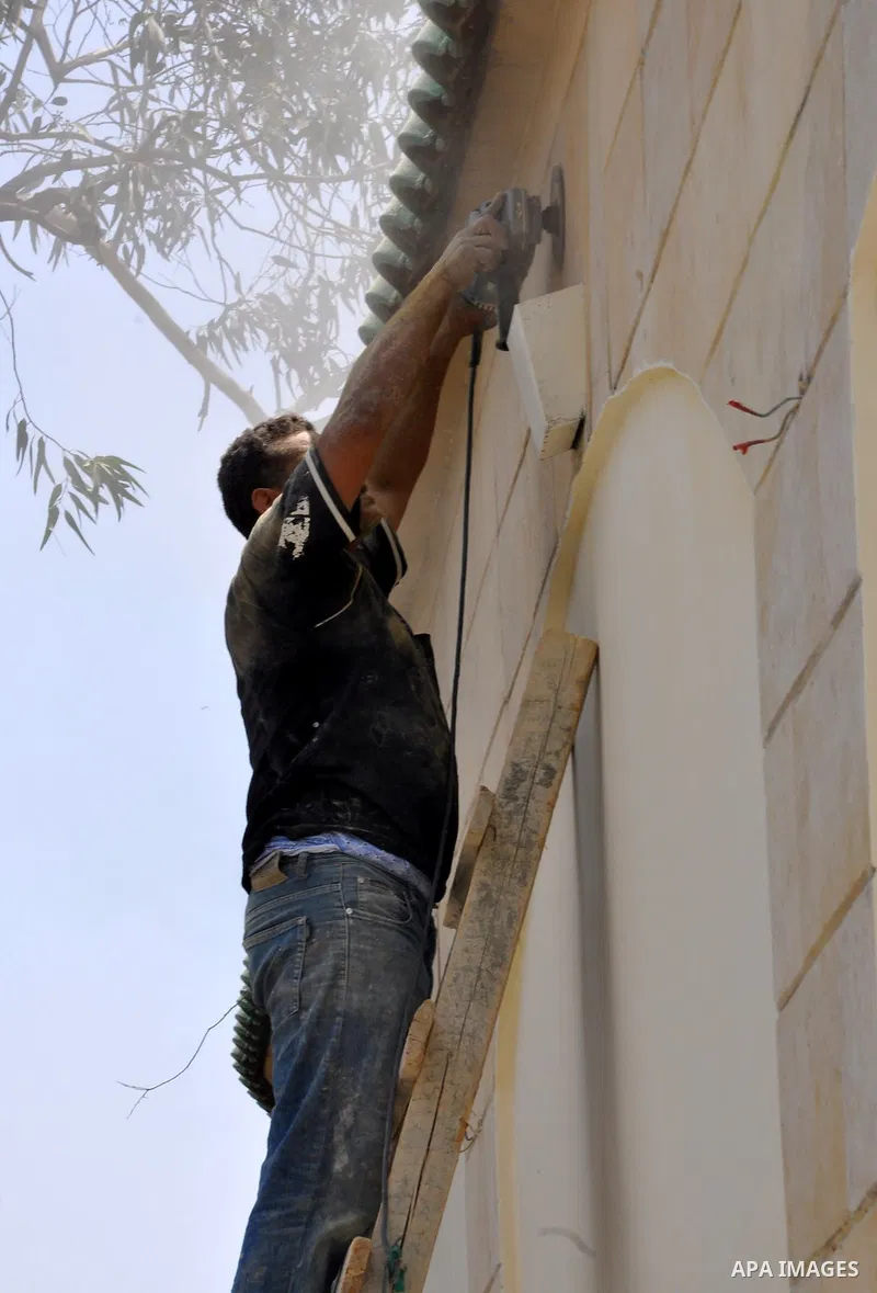 Egyptian workers repair the roads at the Square of Rabaa El Adawiya in Cairo on August 22, 2013. Mubarak may leave jail on Thursday by court order after a week of bloody turmoil in which Egypt's new army-backed rulers cr...