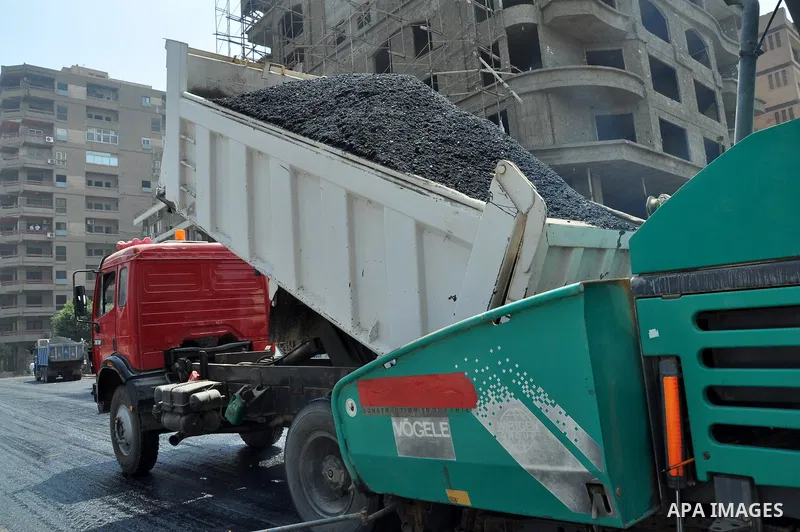 Egyptian workers repair the roads at the Square of Rabaa El Adawiya in Cairo on August 22, 2013. Mubarak may leave jail on Thursday by court order after a week of bloody turmoil in which Egypt's new army-backed rulers cr...