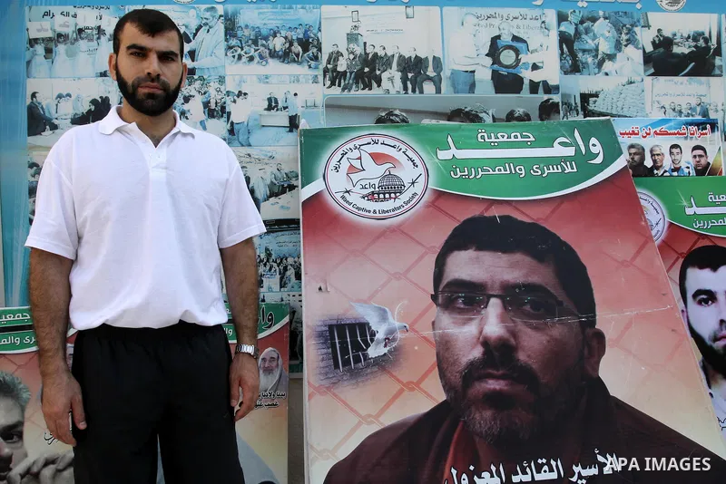 Freed Palestinian prisoner Ayman Abu Daoud poses for a photograph during a press conference upon his arrival to the Gaza Strip through Beit Hanoun crossing (Erez), in Gaza City on Aug 22, 2013. Daoud, 37, arrived in the...