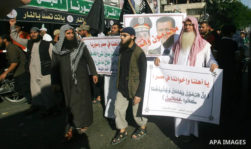 Palestinian Salafists shout slogans during a rally in protest of what they say are recent massacres committed against Syrian and Egyptian people and against Syria's President Bashar al-Assad and Egypt's army chief Genera...