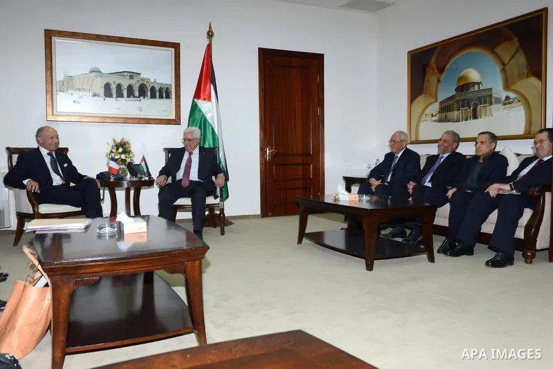 French Foreign Affairs Minister Laurent Fabius meets with Palestinian President Mahmoud Abbas in the West Bank city of Ramallah on 24 August 2013. Proof of chemical weapons use by the Syrian regime would require a 'react...