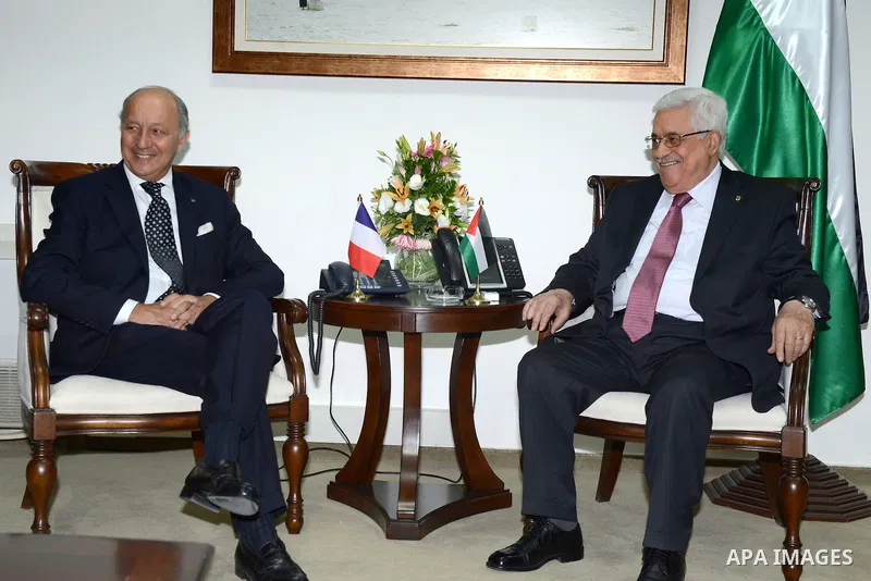 French Foreign Affairs Minister Laurent Fabius meets with Palestinian President Mahmoud Abbas in the West Bank city of Ramallah on 24 August 2013. Proof of chemical weapons use by the Syrian regime would require a 'react...