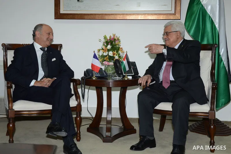 French Foreign Affairs Minister Laurent Fabius meets with Palestinian President Mahmoud Abbas in the West Bank city of Ramallah on 24 August 2013. Proof of chemical weapons use by the Syrian regime would require a 'react...