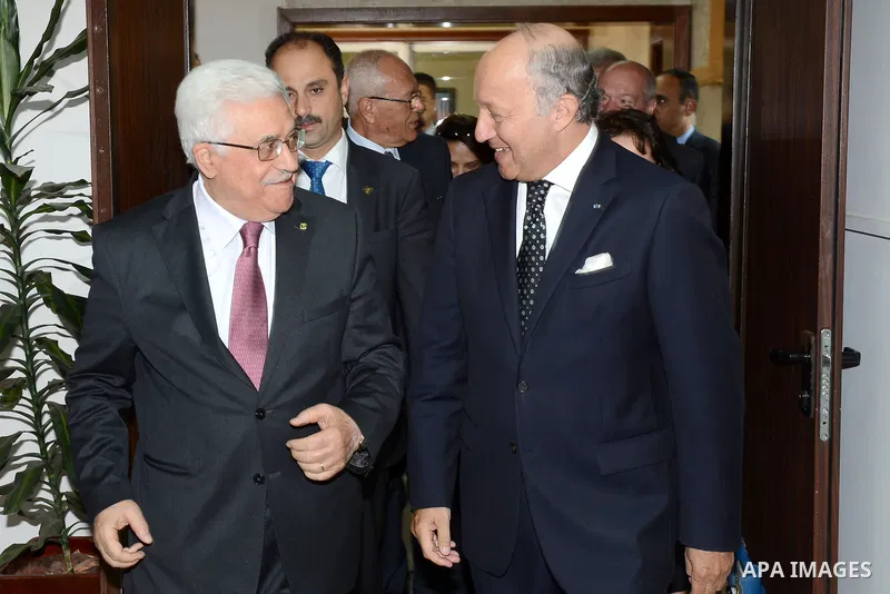 French Foreign Affairs Minister Laurent Fabius meets with Palestinian President Mahmoud Abbas in the West Bank city of Ramallah on 24 August 2013. Proof of chemical weapons use by the Syrian regime would require a 'react...