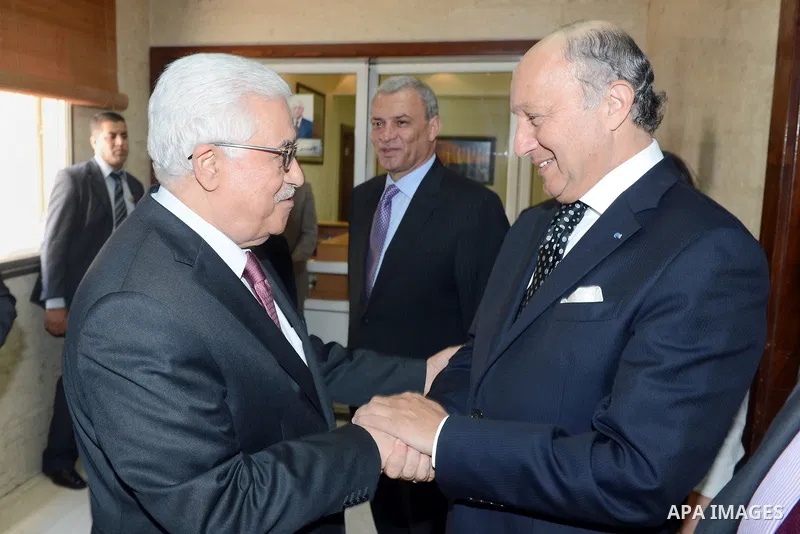 French Foreign Affairs Minister Laurent Fabius meets with Palestinian President Mahmoud Abbas in the West Bank city of Ramallah on 24 August 2013. Proof of chemical weapons use by the Syrian regime would require a 'react...