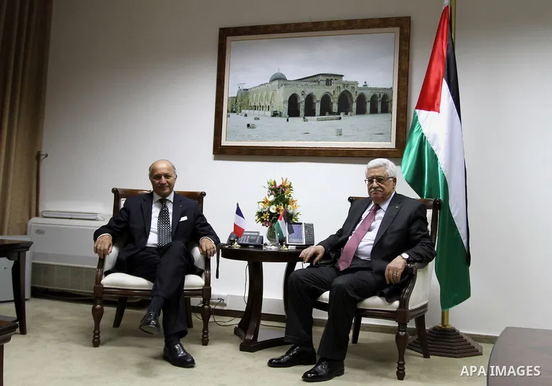 French Foreign Affairs Minister Laurent Fabius (L) meets with Palestinian President Mahmoud Abbas (R) in the West Bank city of Ramallah on 24 August 2013. Proof of chemical weapons use by the Syrian regime would require...