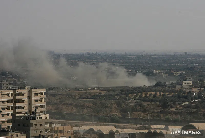 Smoke is seen after the Egyptian army exploded a smuggling tunnel dug beneath the Gaza-Egypt border, in the southern Gaza Strip August 24, 2013. Photo by Eyad Al Baba