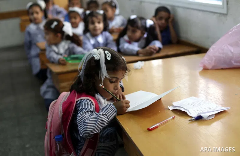 Palestinian school children attend a class at a U.N.-run school in Dir al-Balah in the central Gaza Strip, on the first day of the school year August 25, 2013. Photo by Ashraf Amra