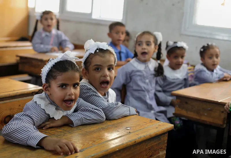 Palestinian schoolchildren attend a class at a U.N.-run school in Dir al-Balah in the central Gaza Strip, on the first day of the school year August 25, 2013. Photo by Ashraf Amra