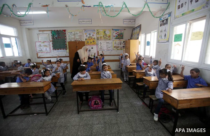 Palestinian school children attend a class at a U.N.-run school in Dir al-Balah in the central Gaza Strip, on the first day of the school year August 25, 2013. Photo by Ashraf Amra
