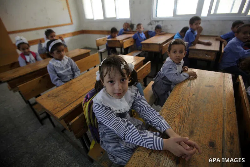 Palestinian school children attend a class at a U.N.-run school in Dir al-Balah in the central Gaza Strip, on the first day of the school year August 25, 2013. Photo by Ashraf Amra