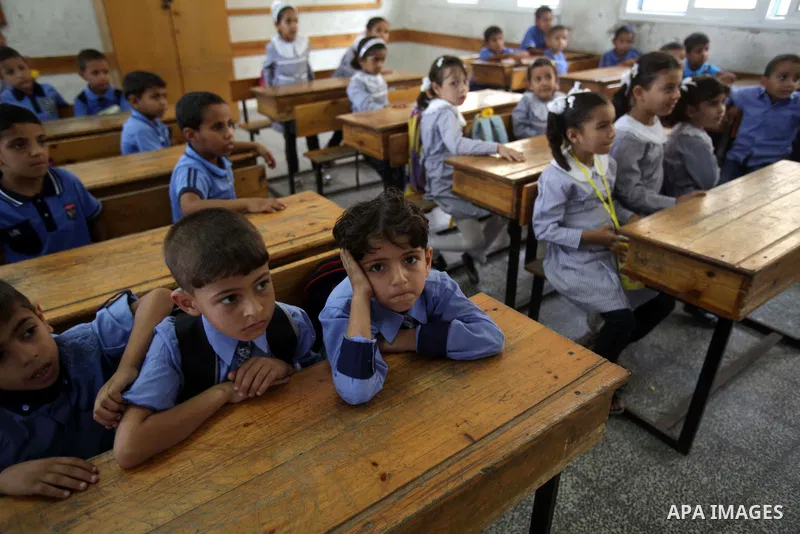 Palestinian school children attend a class at a U.N.-run school in Dir al-Balah in the central Gaza Strip, on the first day of the school year August 25, 2013. Photo by Ashraf Amra
