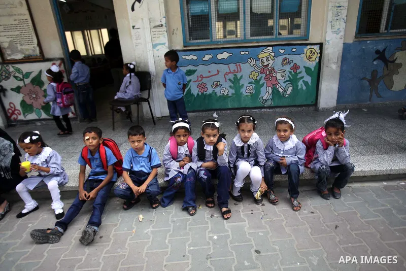 Palestinian school children attend a class at a U.N.-run school in Dir al-Balah in the central Gaza Strip, on the first day of the school year August 25, 2013. Photo by Ashraf Amra