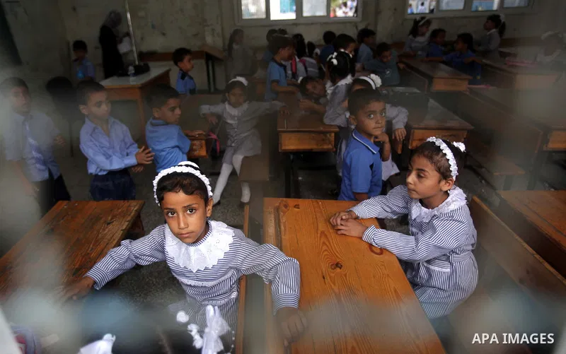 Palestinian school children attend a class at a U.N.-run school in Dir al-Balah in the central Gaza Strip, on the first day of the school year August 25, 2013. Photo by Ashraf Amra