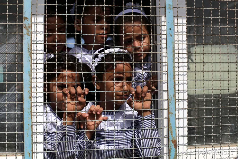 Palestinian school children attend a class at a U.N.-run school in Dir al-Balah in the central Gaza Strip, on the first day of the school year August 25, 2013. Photo by Ashraf Amra