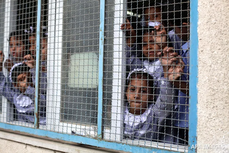 Palestinian school children attend a class at a U.N.-run school in Dir al-Balah in the central Gaza Strip, on the first day of the school year August 25, 2013. Photo by Ashraf Amra