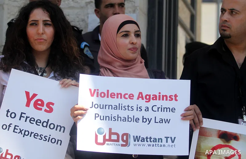 Palestinian journalists gather in front of the Interior Ministry in the West Bank city of Ramallah on August 25, 2013, to protest against the harassment of on-duty journalists and photographers by security forces. Photo...