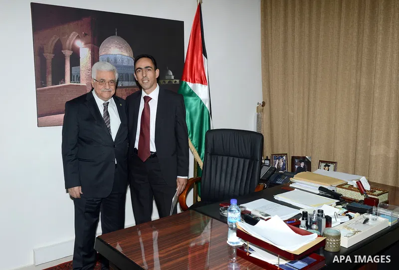 Palestinian President Mahmoud Abbas (Abu Mazen) meets with contest winner the President in the West Bank city of Ramallah on August 25, 2013. Photo by Thaer Ganaim