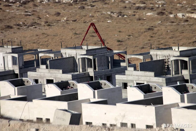 A picture shows the construction site in Pisgat Zeev, an urban settlement in an area Israel annexed to Jerusalem after capturing it in the 1967 Middle East war, near the Arab village of Beit Hanina, August 25, 2013. Pale...