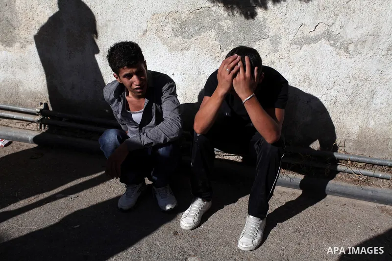 Relatives mourn the deaths of two Palestinians shot dead by Israeli troops, at a hospital in the West Bank city of Ramallah August 26, 2013. Israeli troops on Monday shot dead two Palestinians and wounded more than a doz...