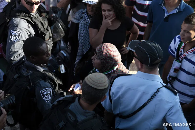 Palestinian protesters argue with Israeli security forces during a demonstration against killing three Palestinians at Qalandiya Refugee Camp by Israeli troops, at Damascus gate in Jerusalem's Old City August 26, 2013. I...