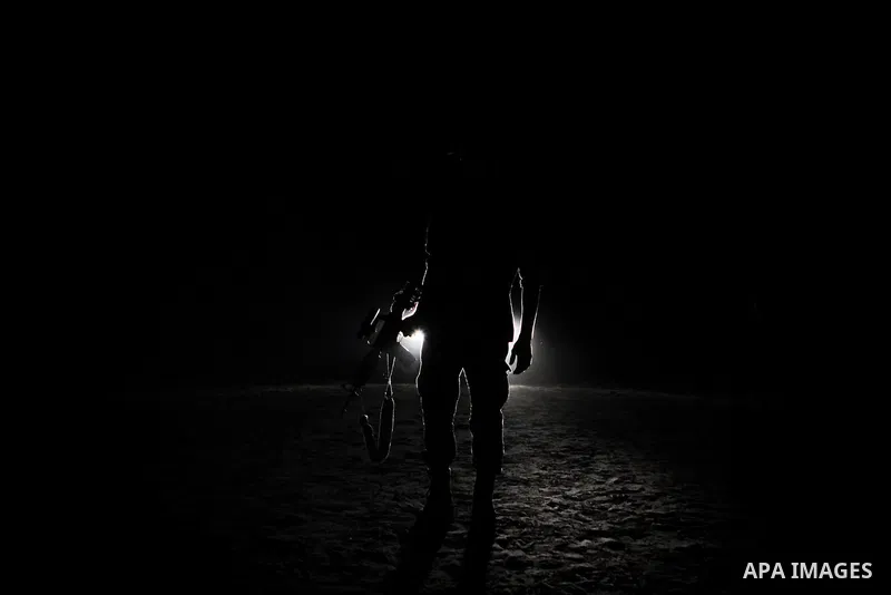Palestinian militants of al-Nasser Salah al-Din Brigades, the armed wing of the Popular Resistance Committees (PRC), take part in a night military-style exercises at a training camp in Rafah in the southern Gaza Strip, A...