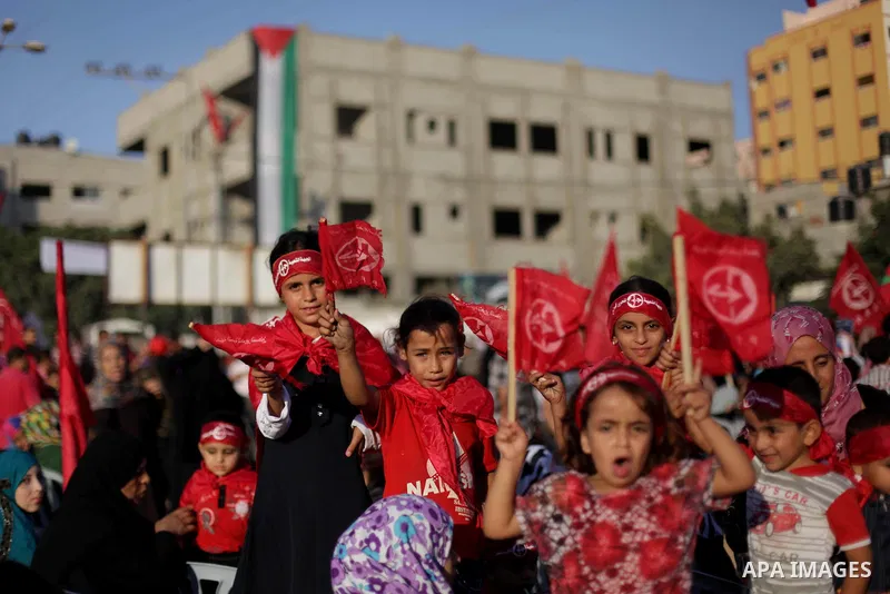 Palestinian supporters of Popular Front for the Liberation of Palestine (PFLP) take part in a rally marking the 12th anniversary of the killing of Abu Ali Mustafa, leader of (PLFP), in Gaza City August 27, 2013. Abu Must...