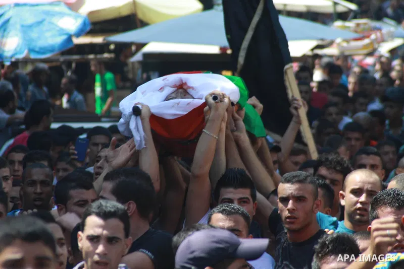 Palestinians carry the body of Kareem Abo Sbeih during his funeral in the Jenin refugee camp, near the West Bank city of Jenin August 31, 2013. Abo Sbeih died from his wounds on Saturday after Israeli soldiers shot dead...