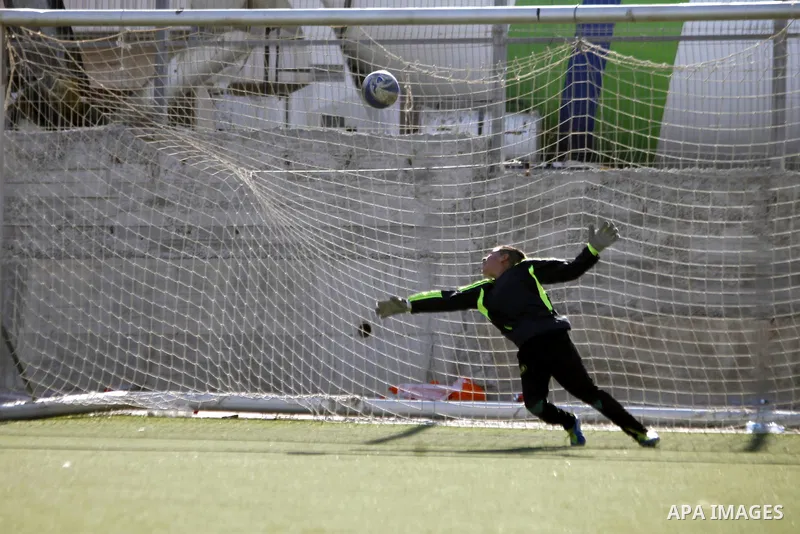 Palestinian boys play soccer during training exercises at a playground in Jerusalem, Aug. 31, 2013. About 200 Palestinian boy from the West Bank participated in the exercises to join the Palestinian Football Academy for...