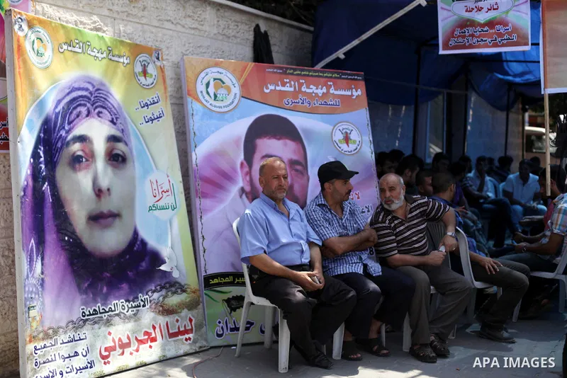 Palestinians take part in a protest calling for the release of Palestinian prisoners held in Israeli jails in in Gaza City on Sep. 01, 2013. Photo by Ashraf Amra
