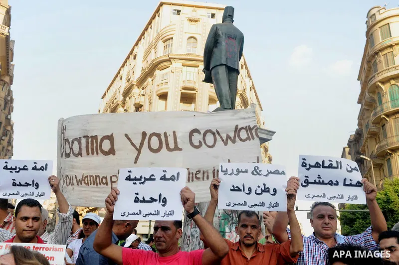 Egyptian protesters shout slogans against the US administration before an Arab Foreign Ministers meeting, the League s headquarters in Cairo, Egypt, 01 September 2013. The meeting is expected to focus on the Syrian crisi...