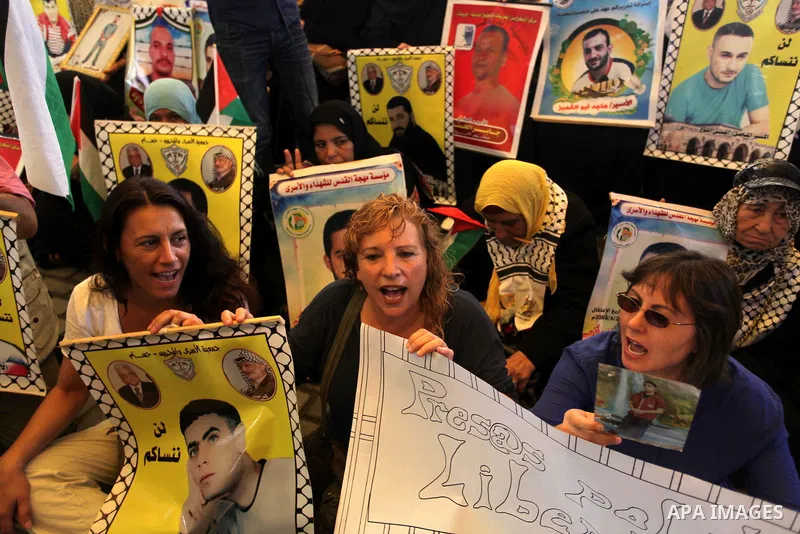 Delegation of the Spanish take part in a protest calling for the release of Palestinian prisoners held in Israeli jails in Gaza City on Sep. 02, 2013. Photo by Ashraf Amra