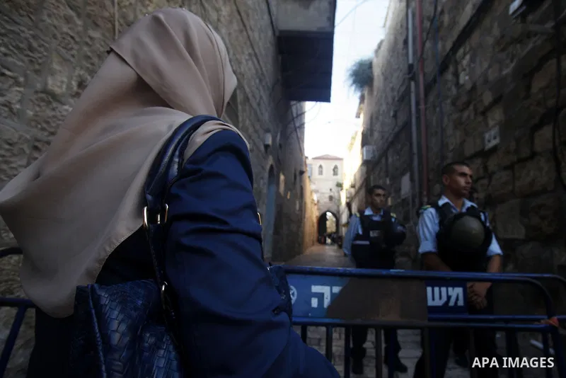Israeli policemen stand guard during a protest in Jerusalem's Old City, as minor clashes take place at a nearby compound known to Muslims as Noble Sanctuary and to Jews as Temple Mount September 4, 2013. An Israeli polic...
