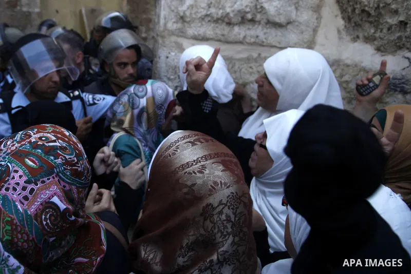 Palestinian women protest in Jerusalem's Old City, as minor clashes take place at a nearby compound known to Muslims as Noble Sanctuary and to Jews as Temple Mount September 4, 2013. An Israeli police spokesperson said f...