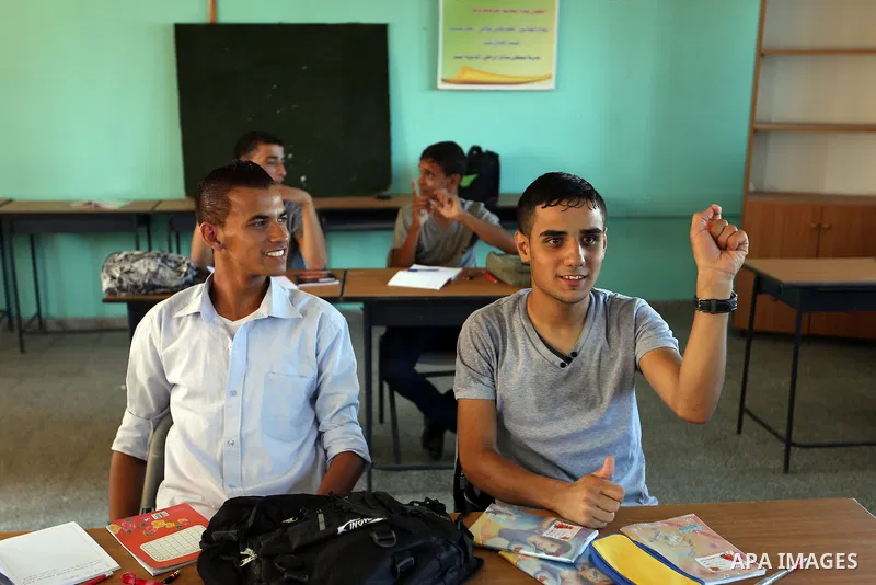 Deaf Palestinian students get lessons at a special education school in Gaza City on Sept. 05, 2013. The school is the first in Gaza Strip that helps high school deaf students to join the University. Photo by Mahmoud Hamd...