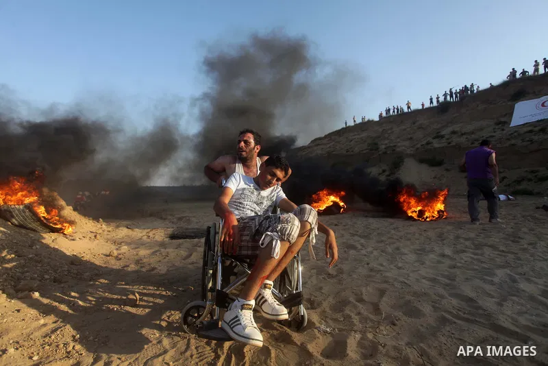 During a drill, Palestinian medics attend to a 'victim' of an explosion as part of an exercise of a graduation ceremony of medics, in Mughraqa, central Gaza Strip, Thursday, Sept. 5, 2013. Medics from the Palestine Red C...