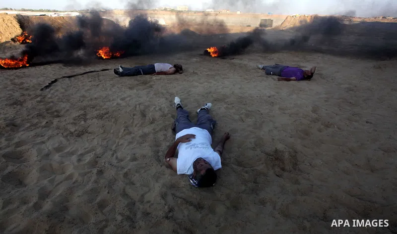During a drill, Palestinian medics attend to a 'victim' of an explosion as part of an exercise of a graduation ceremony of medics, in Mughraqa, central Gaza Strip, Thursday, Sept. 5, 2013. Medics from the Palestine Red C...